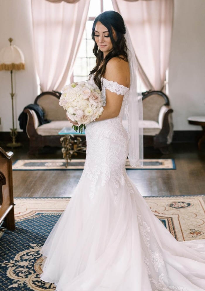 Model wearing a white bridal dress